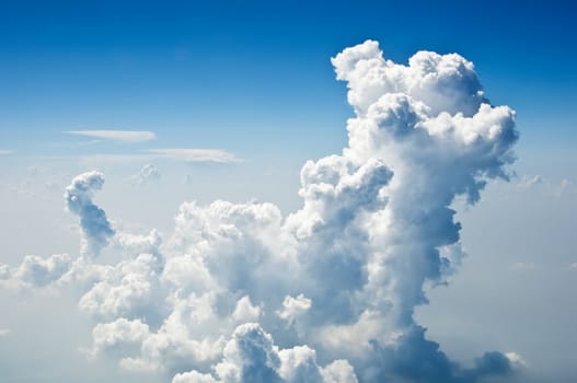 Fluffy clouds shot from airplane window