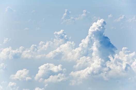 Fluffy clouds shot from airplane window