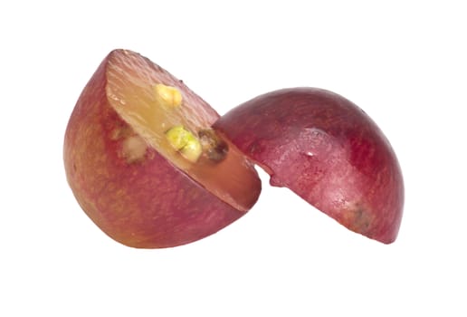 Translucent slice of red grape fruit, macro isolated on white 