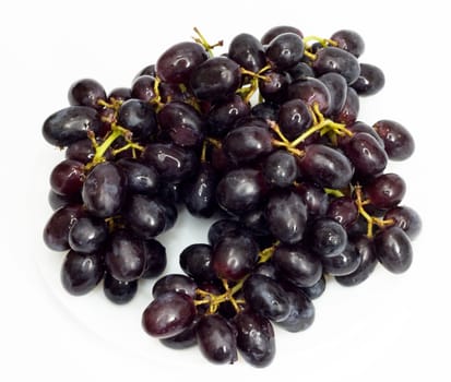 Bunch of black grapes isolated on white background 