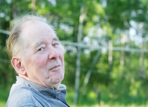 Elderly man enjoying summer outdoors