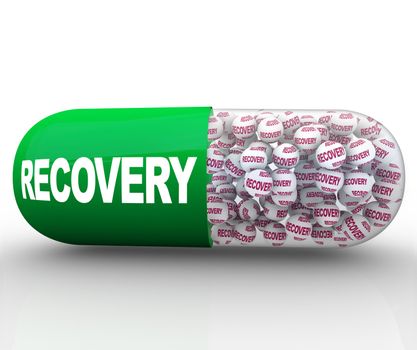 A green and translucent capsule pill filled with balls reading Recovery, symbolizing the treatment and cure of a medical condition or a conceptual issue such as a recession