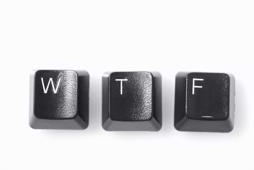 WTF!  Computer keys shot against white