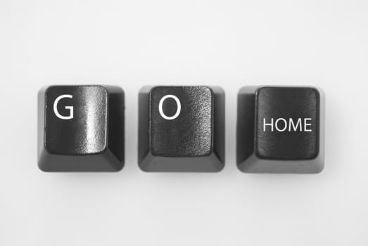 Computer keys spelling "GO Home" shot against white