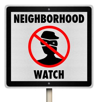 A metal sign reading Neighborhood Watch symbolizing a warning for security telling robbers and burglars that they are being watched