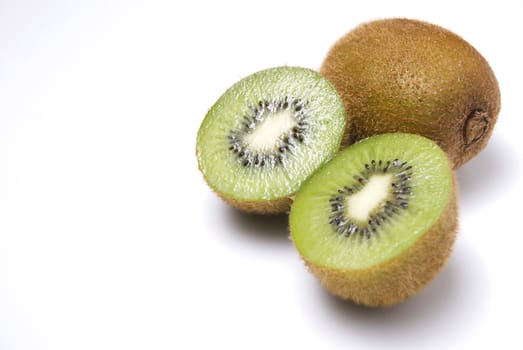 Whole and sliced kiwi fruit on white background