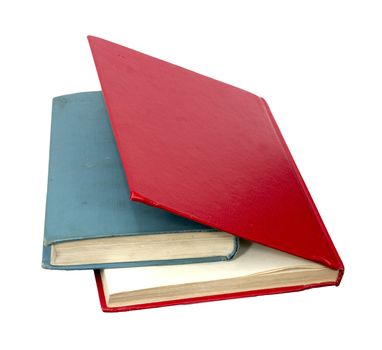 closed red and blue books on a reflecting white background 