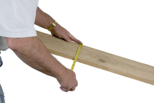 Carpenter taking measurement of board width on a white background
