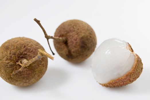 Three pieces of Lychees on white background