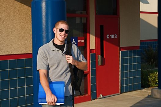 Young college students outside of a classroom at a public university