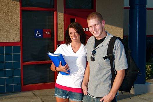 Young college students outside of a classroom at a public university