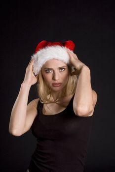 Sexy santa helper on a black background