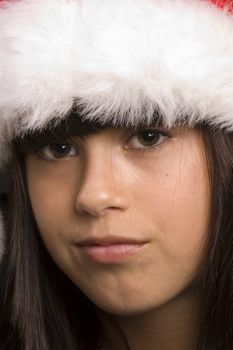 cute young girl wearing a santa hat