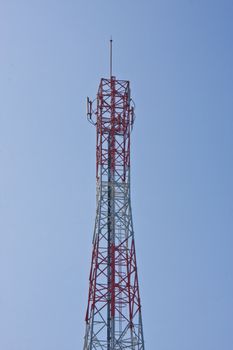 Mobile phone communication repeater antenna tower in blue sky