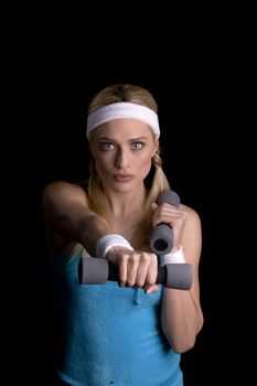Woman doing exercise with weights over a black background