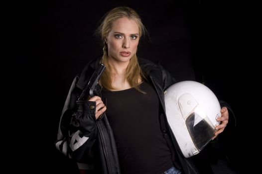 Female motorcyclist with a gun and helmet