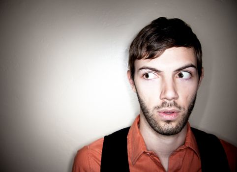 Apprehensive Young Man Looking to his Left