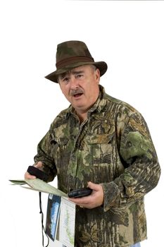 Man in Camouflage clothing using national forest maps and two gps's to check position on a white background