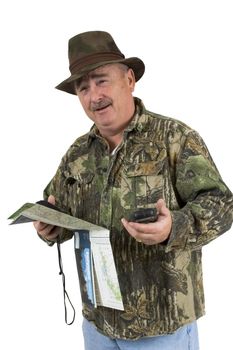 Man in Camouflage clothing using national forest maps and two gps's to check position on a white background