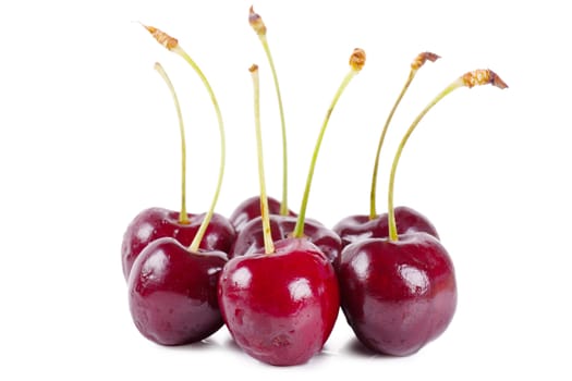 Close up view of cherries over white background