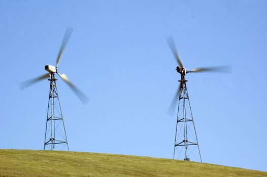 wind generators in california taken at a slower shutter speed so as to illustrate the speed of the blades