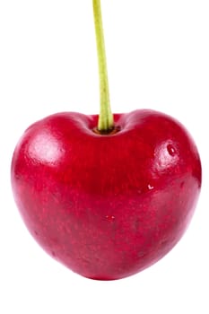 Close up view of heart shaped cherry isolated over white background