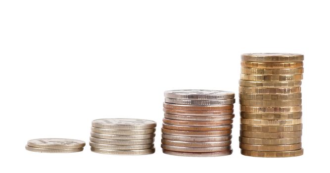 Raising stacks of coins isolated over white