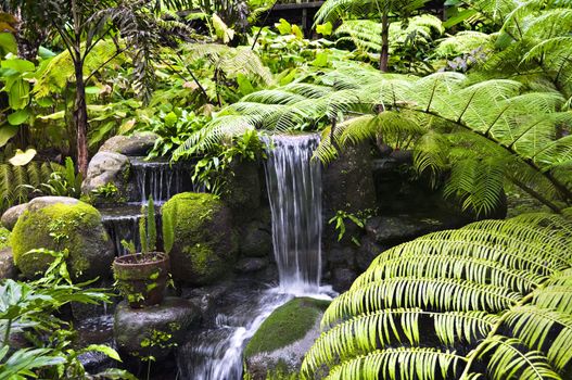 Small manmade waterfall inside a private park