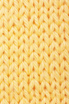 Macro view of yellow knitting.