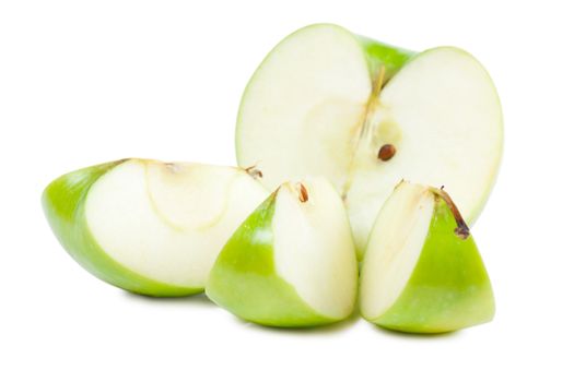 Parts of big green apple isolated over white background