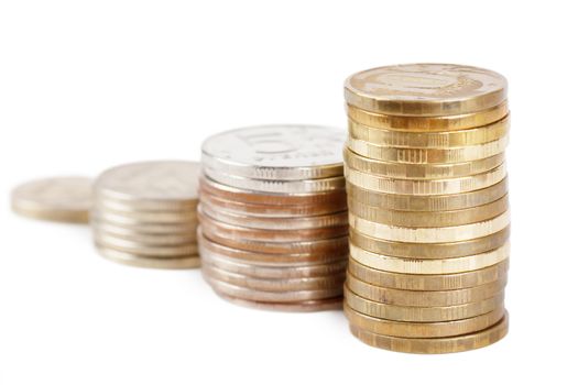 Stacks of coins over white background