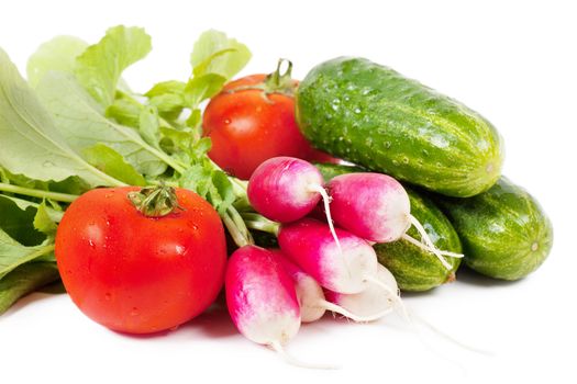 Fresh washed vegetables over white background