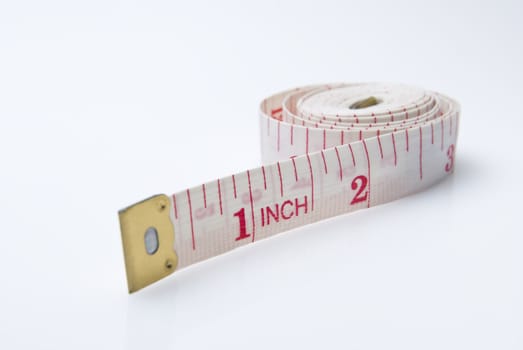 Studio shot of measuring tape against white background