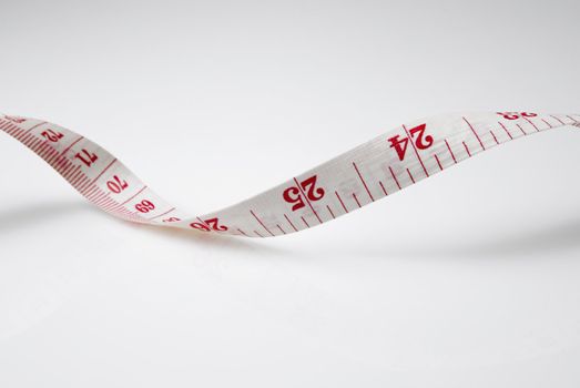 Studio shot of measuring tape against white background