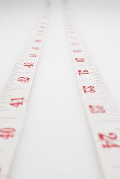 Studio shot of measuring tape against white background