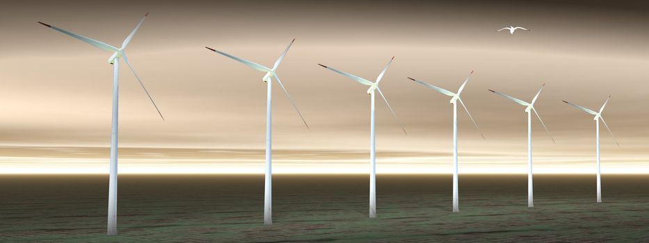 Bird flying upon wind turbines on in a cloudy sky