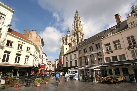 Antwerp shopping street with church tower