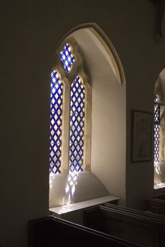 window in Norman style Church at Whitchurch in Dorset, England