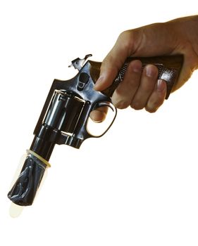 Cropped shot of a male hand holding a .38 calibre with a condom on it.