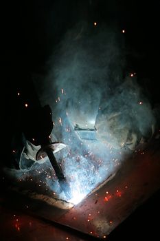 Electric welding of details at a modern factory