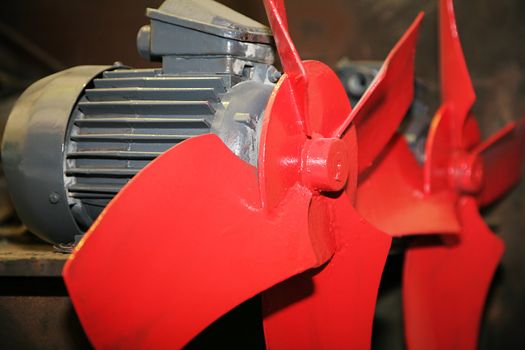 Two red electric fans for the industry