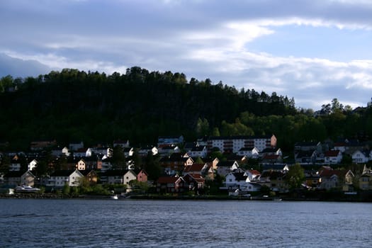 the city holmestrand (vestfold, Norway) as seen from a passenger in a boat