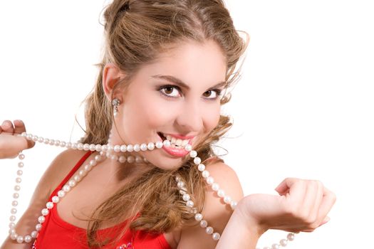 beautiful brunette with a string of pearls between her white teeth