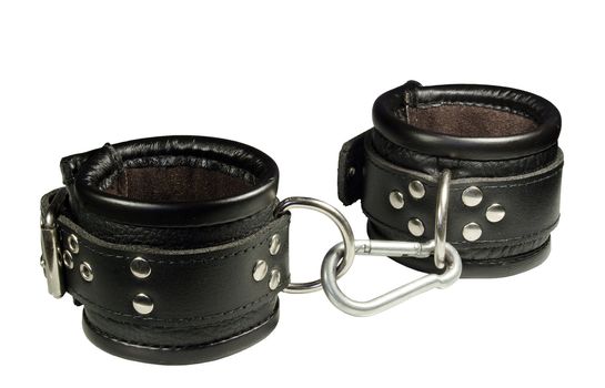 High quality leather handcuffs fully isolated on white. Clipping Path included.