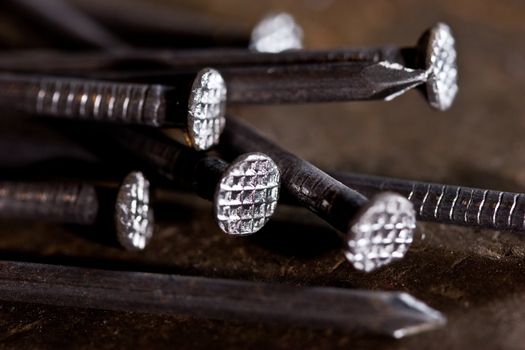 tools series: metal nails on the steel plate