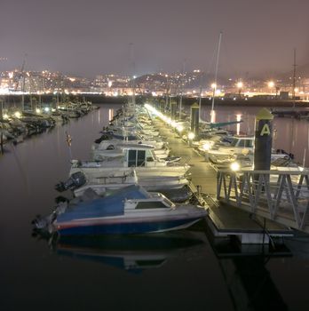 image of some boats resting in a calm sea