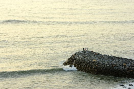 Image of people practicing the sport of sea fishing