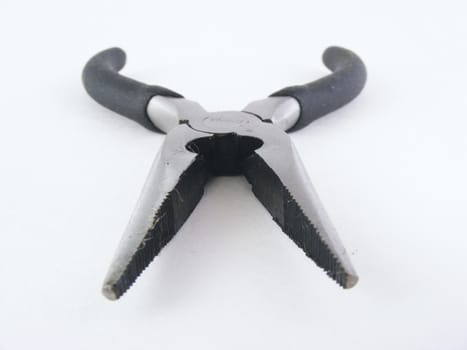 A pair of needle nose pliers.