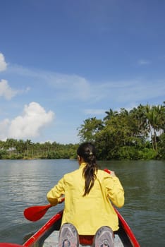 Woman in canoe paddling