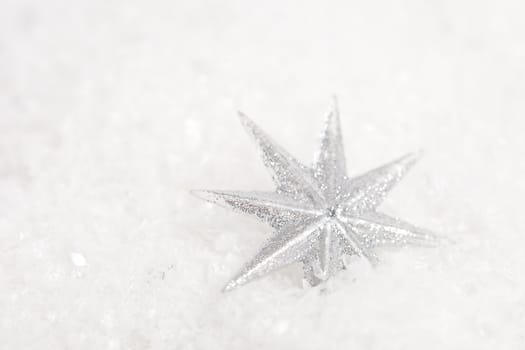 Beautiful christmas stars on fake white snow